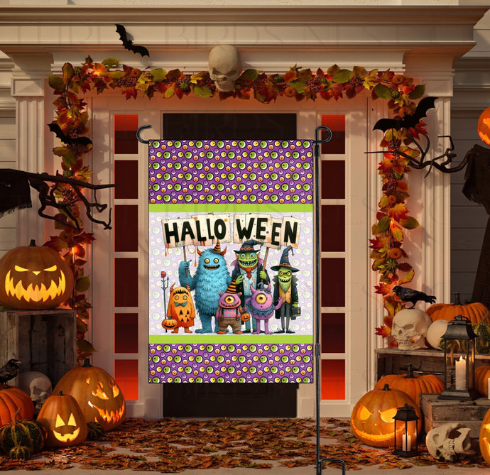 An adorable Halloween Garden Flag featuring a group of Monsters with their Halloween sign on a background of colorful eye balls.