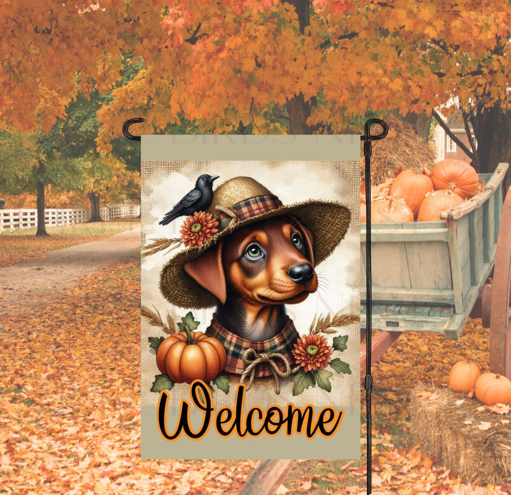 An adorable Red and Tan Doberman Pinscher Puppy Dog dressed as a Scarecrow with a Welcome Fall message.