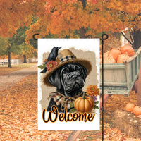 An adorable black Cane Corso Mastiff Puppy Dog dressed as a Scarecrow with a Welcome Fall message.