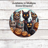 A spooky group of Zombie Halloween cats with Nightmare style jack o lanterns.