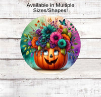 
              An adorable Fall and Halloween Pumpkin planter filled with bright colored flowers
            