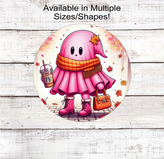 An adorable pink Ghost is ready for Fall Sweater Weather with her iced Coffee and scarf