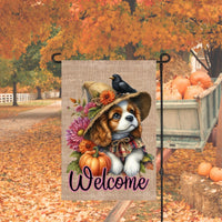 An adorable Cavalier King Charles Spaniel Puppy Dog dressed as a Scarecrow with a Welcome Fall message.