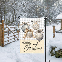 A beautiful Merry Christmas Garden Flag with silver and gold ornaments on a buffalo plaid background.