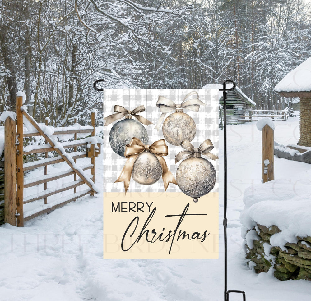 A beautiful Merry Christmas Garden Flag with silver and gold ornaments on a buffalo plaid background.