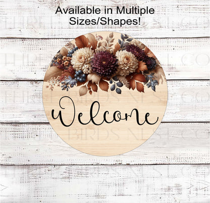 A beautiful Welcome Wreath Sign with Mums and Fall Florals on a rustic wood look background.