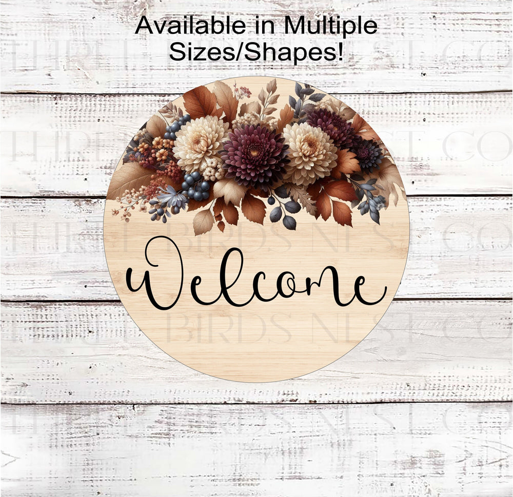 A beautiful Welcome Wreath Sign with Mums and Fall Florals on a rustic wood look background.