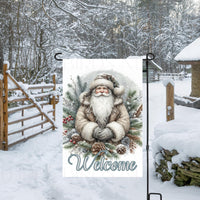 A Woodland Santa Claus Garden Flag that is perfect for your Christmas decor.