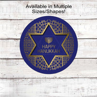 A beautiful Happy Hanukkah sign with gold accents and the Star of David