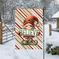 An adorable Christmas Elf with a sign that says BELIEVE- this Garden Flag is perfect for your Winter yard decor.