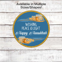 A beautiful Happy Hanukkah sign with gold accents and Menorahs