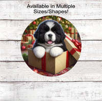 
              An adorable Landseer Newfoundland puppy in a Christmas gift box.
            