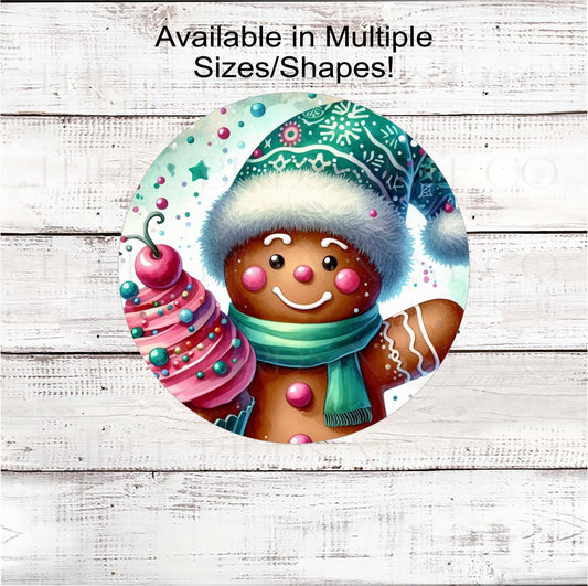 An adorable Gingerbread Man in a Christmas hat holding a cupcake