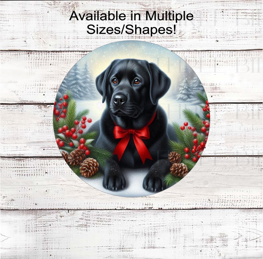 A black Labrador Retriever with in festive Winter setting and a red bow around his neck.