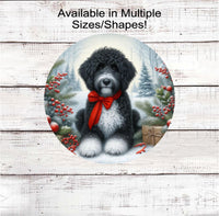 
              A black and white Poodle dog with in festive Winter setting and a red bow around his neck.
            