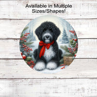 A black and white Poodle dog with in festive Winter setting and a red bow around his neck.