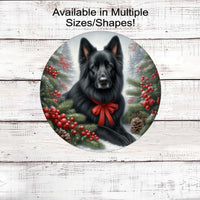 A black German Shepherd dog in festive Winter setting with a red bow