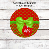 An adorable Christmas Wreath Sign that looks like a red and lime green package with a gift tag.