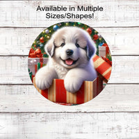 An adorable Great Pyrenees puppy in a Christmas gift box.