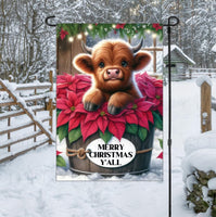 
              A beautiful brown Baby Highland Cow with poinsettia flowers
            