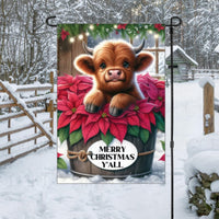 A beautiful brown Baby Highland Cow with poinsettia flowers