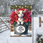 A beautiful Baby Highland Cow Goat with poinsettia flowers