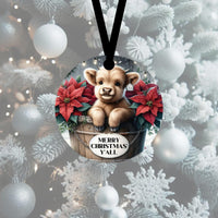 
              An adorable baby Highland Cow in a wooden tub surrounded by poinsettias.
            