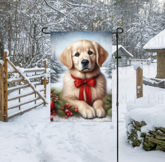 A light Golden Retriever in a Winter setting with a red bow on