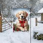 A light Golden Retriever in a Winter setting with a red bow on