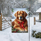 A dark Golden Retriever in a Winter setting with a red bow on