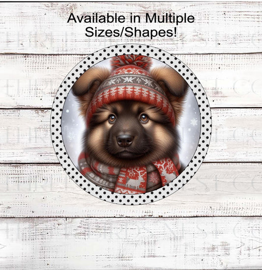 An adorable German Shepherd puppy in a hat and scarf in a Winter setting