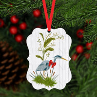 
              A beautiful Christmas ornament with a Blue Heron wearing a festive red bow.
            