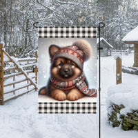 An adorable sable German Shepherd in a Winter scarf and hat