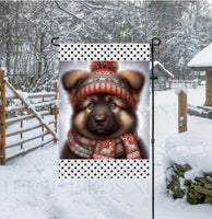 
              An adorable sable German Shepherd in a Winter scarf and hat
            