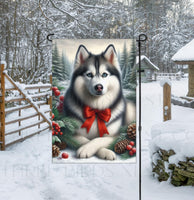 
              A beautiful black Siberian Husky in a Winter setting with a festive bow on.
            