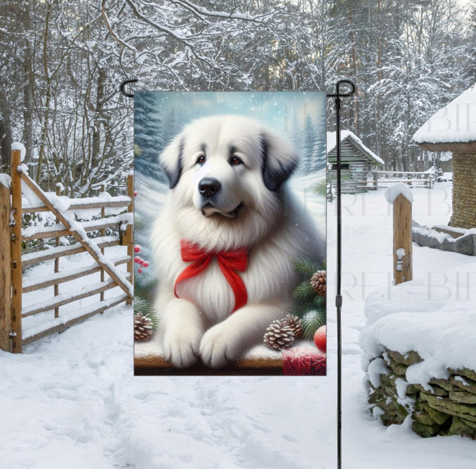 An adorable Great Pyrenees dog in a snowy Winter setting wearing a red bow.