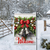 A beautiful Christmas Welcome Flag with Silver Bells and greenery with ornaments.