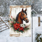 A beautiful brown horse with poinsettia flowers on a rustic wood background.