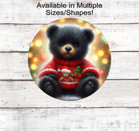 
              An adorable black Teddy Bear in a Christmas Sweater
            