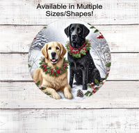 
              A black Labrador Retriever and a Golden Retriever dog in Christmas collars in a winter woodland setting
            