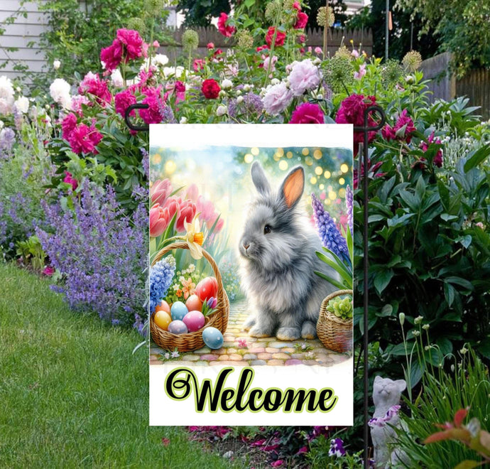 A beautiful Easter Bunny with a basket of Eggs surrounded by bright Spring flowers.