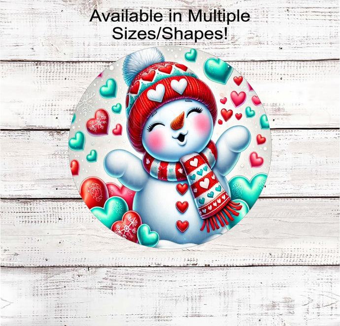 This adorable Snowman is blowing kisses surrounded by red, pink and turquoise hearts is ready to be your Valentine!