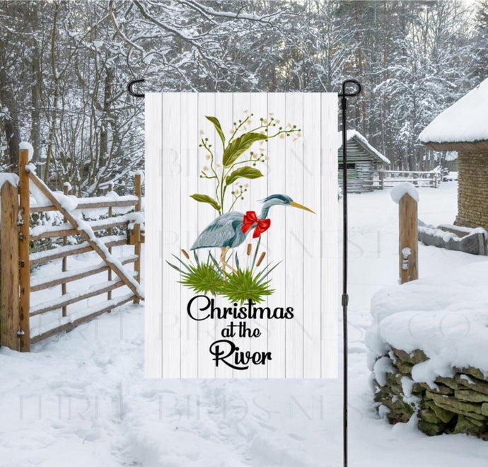 This flag featuring a Christmas at the River Blue Heron will be perfect for your Nautical Decor