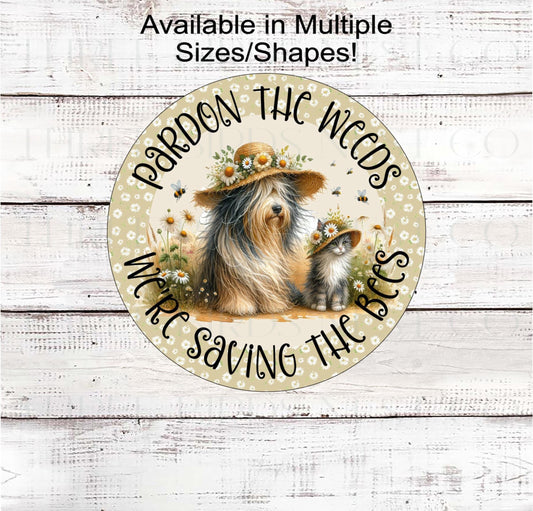 Parden the Weeds-We&#39;re Saving the Bees! This adorable dog and cat are sitting in the daisies and dandelions with honeybees flying around.