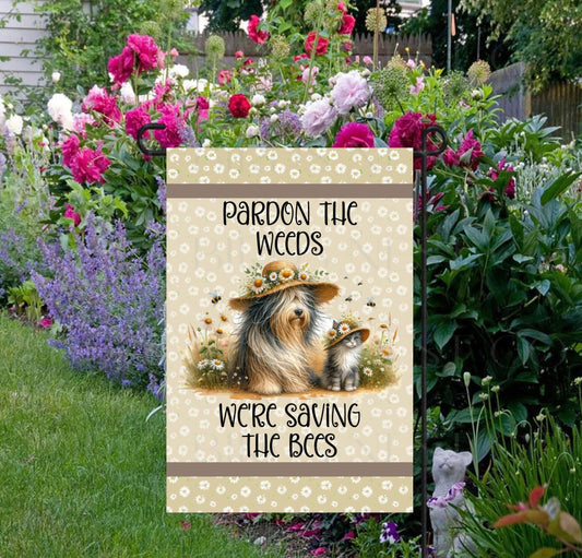 Pardon the Weeds, Were Saving the Bees Garden Flag with an adorable cat and dog with Spring flowers and weeds