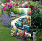 A beautiful vintage teal truck carrying spring flowers