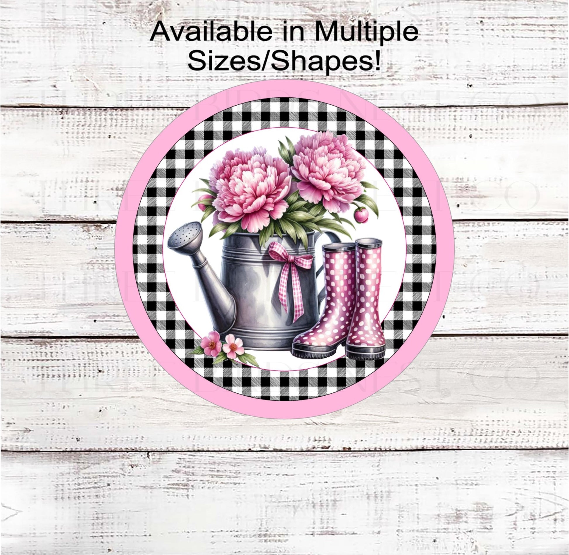 A beautiful watering can with pink Peonies and pink polka dot rain boots.