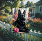 A beautiful black German Shepherd dog surrounded by gorgeous flowers.