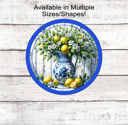 A beautiful Chinoiserie vase full of Lemon branches with fresh lemons and flowers.