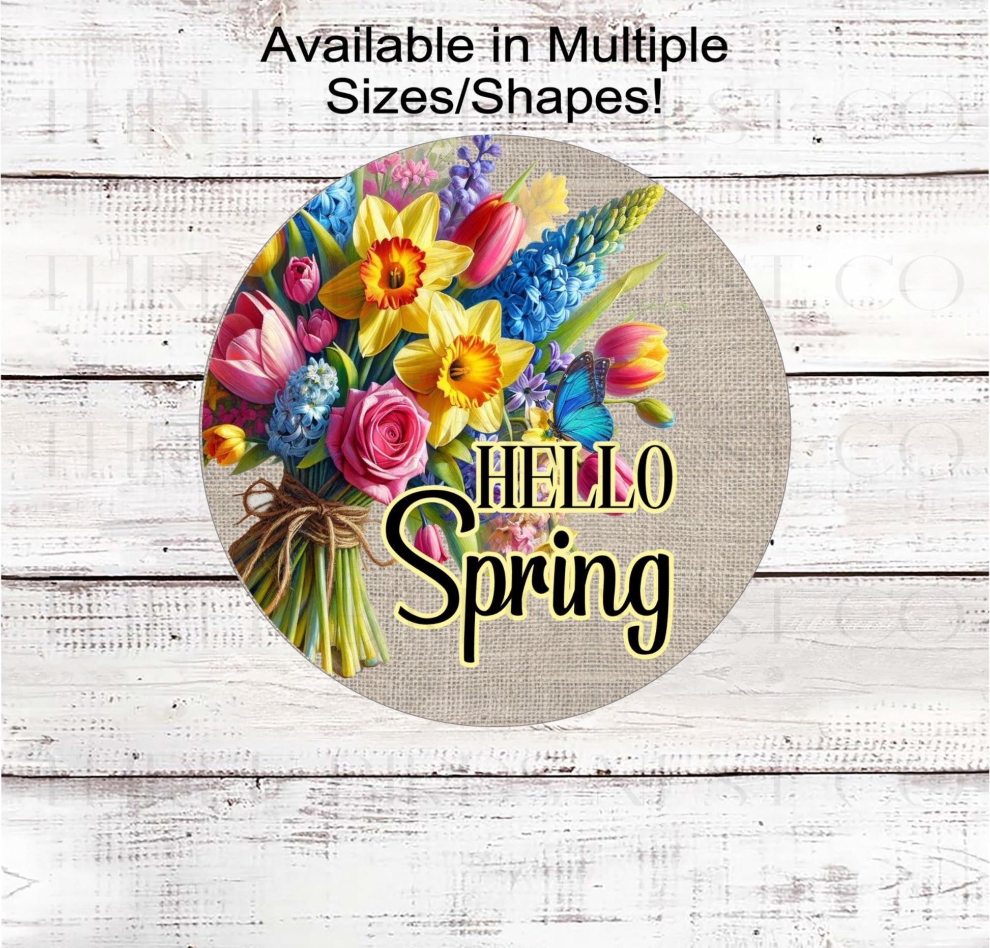 A beautiful bouquet of Spring Flowers and a Hello Spring message on a burlap background.